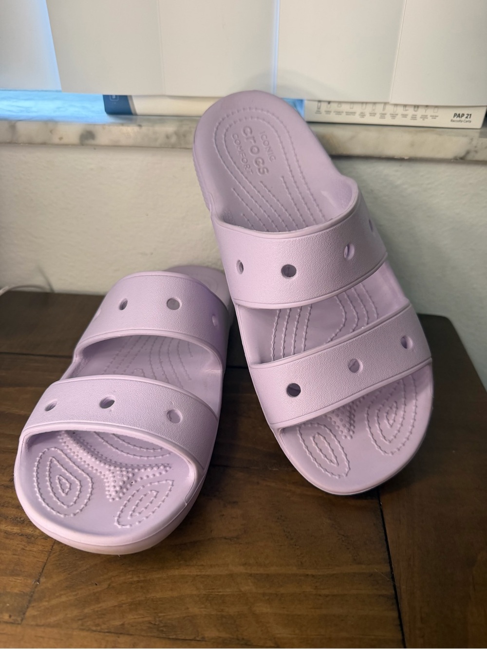 Crocs Classic Sandals in a light purple color, featuring two straps M6 W8